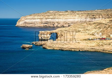 Gozo Malta - The Azure Window and Dwejra bay on a beautiful summer day with clear blue sky