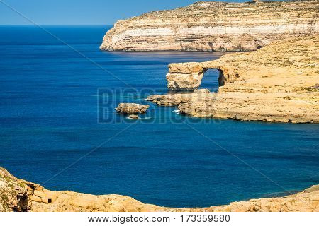 Gozo Malta - The Azure Window and Dwejra bay on a beautiful summer day with clear blue sky
