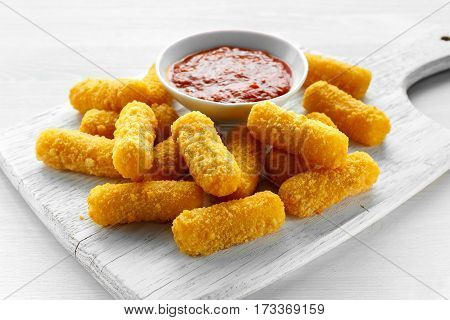 Breaded mozzarella cheese sticks with tomato basil sauce.
