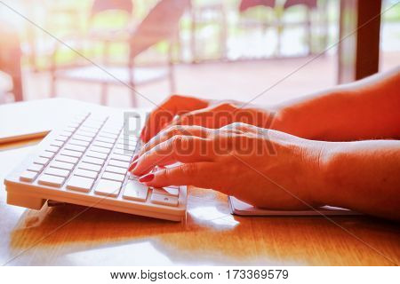 Close Up Of Hands Typing On Computer Keyboard