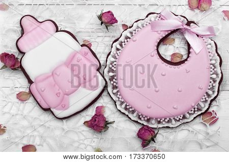 Cookies With Glaze In The Form Of Arcin And Bottle Milk With Petals Of Dried Rosses . On White Woode