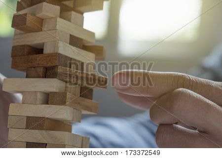 A Male Hand Stopping The Domino Effect. Retro Style Image Executive And Risk Control Concept