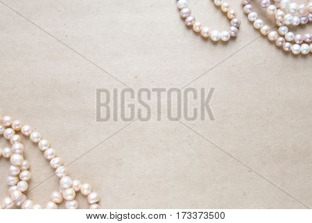 Blank craft background. Sheet of rough paper with rose pearls. Mock up for letter writing, creative work concept.