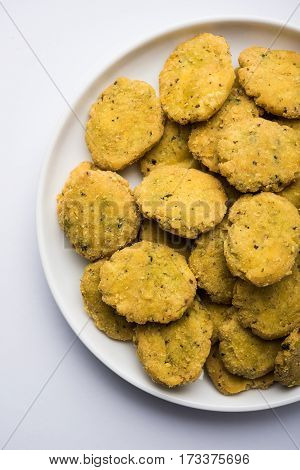 Tasty North Indian snack mathri or mathari served with pickle. Selective focus photograph.