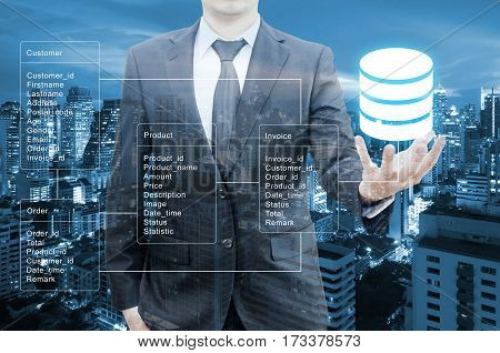 Double Exposure Of Professional Businessman Hold Database Table With Business City Background