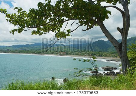 View to the seaside with the black volcanic lava beach in Jaco, Costa Rica.