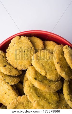 Tasty North Indian snack mathri or mathari served with pickle. Selective focus photograph.