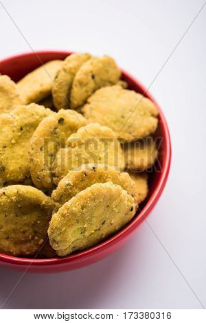 Tasty North Indian snack mathri or mathari served with pickle. Selective focus photograph.