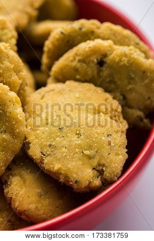 Tasty North Indian snack mathri or mathari served with pickle. Selective focus photograph.