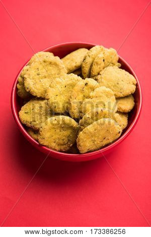Tasty North Indian snack mathri or mathari served with pickle. Selective focus photograph.