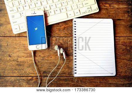 CHIANGMAI THAILAND -Aoril 14 2016: Apple iPhone open Twitter applicationTwitter is an online social networking and microblogging service that enables users to send and read 