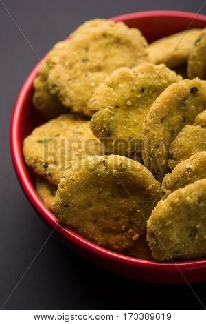 Tasty North Indian snack mathri or mathari served with pickle. Selective focus photograph.