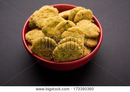 Tasty North Indian snack mathri or mathari served with pickle. Selective focus photograph.