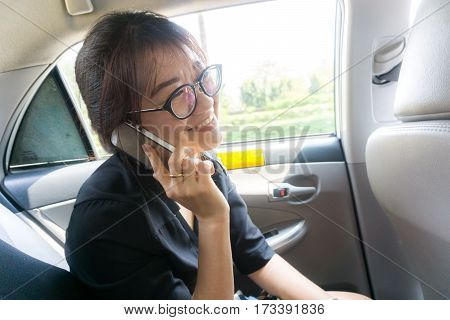 Beautiful Business Asian Woman Taiking Phone While Passenger Tax
