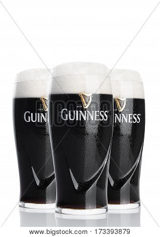 LONDON UK - FEBRUARY 26 2017: Glasses of Guinness original beer on white background. Guinness beer has been produced since 1759 in Dublin Ireland.