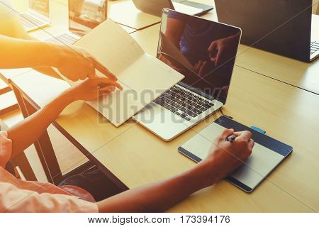 The above view of young man dicussing data at meeting