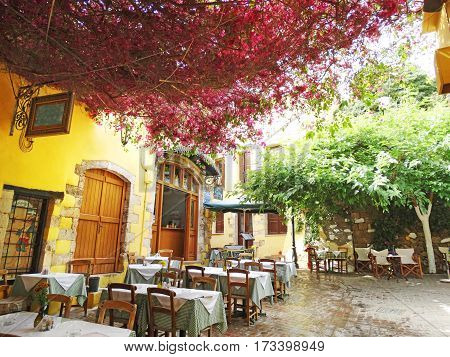 door architecture detail in house building with bougainvillea Greece
