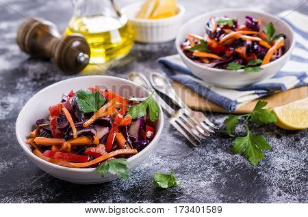 Salad of raw vegetables on a concrete background. Selective focus.