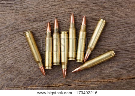 New bullets on old, rustic wooden background.