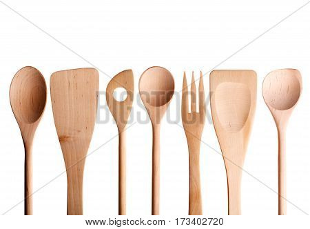 Wooden spoon spatula fork on a white background.