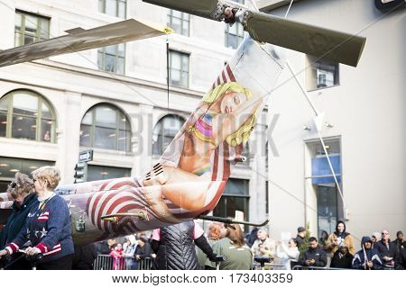 NEW YORK - NOV 11, 2016: Steve Maloney, mixed-media sculpture Take Me Home Huey, a restored US Army Huey air ambulance helicopter from the Vietnam War in the Americas Parade on Veterans Day.