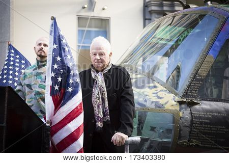 NEW YORK - NOV 11, 2016: Steve Maloney and his mixed-media sculpture Take Me Home Huey, a restored US Army Huey air ambulance helicopter from the Vietnam War in the Americas Parade on Veterans Day.