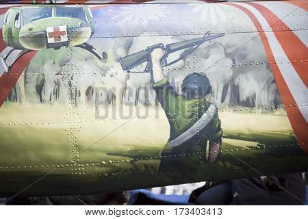 NEW YORK - NOV 11, 2016: Steve Maloney, mixed-media sculpture artist Take Me Home Huey, a restored US Army Huey air ambulance helicopter from the Vietnam War in the Americas Parade on Veterans Day.
