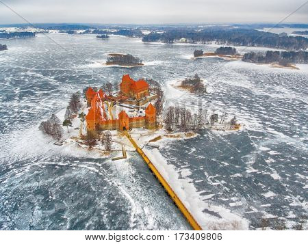 Trakai, Lithuania: aerial winter UAV top view, flat lay of gothic Island Castle. Historical residence in capital city of Grand Duchy of Lithuania, located in Galve lake