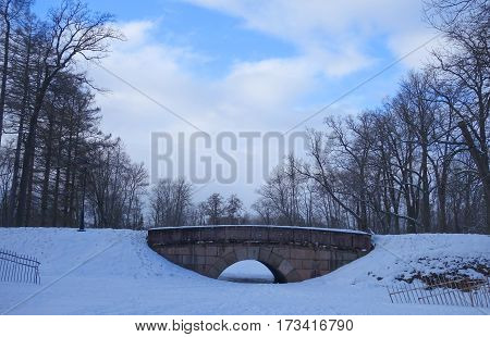 Winter day and the stone bridge in Alexander Park in Tsarskoye Selo