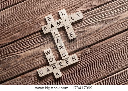 Words of business marketing collected in crossword with wooden cubes