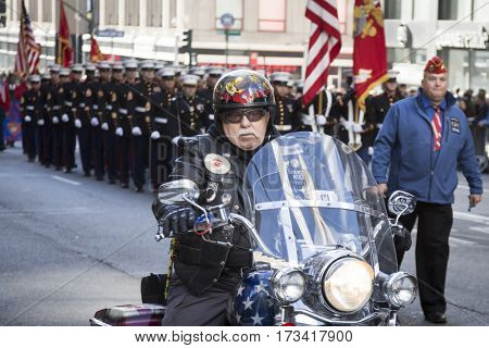 NEW YORK - 11 NOV 2016: Biker and US Marine Corps personnel, USMC march in Americas Parade up 5th Avenue on Veterans Day in Manhattan.