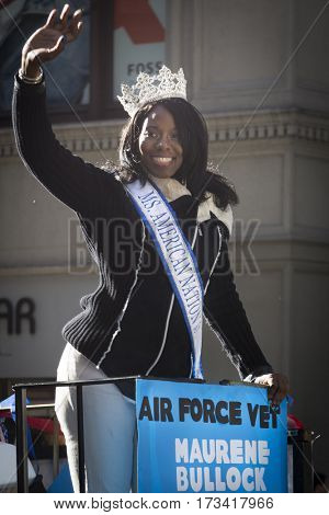 NEW YORK - 11 NOV 2016: US Air Force USAF vet and Ms. American Nation 2017 pageant queen Maurene Bullock waves from a parade float in Americas Parade up 5th Avenue on Veterans Day in Manhattan.