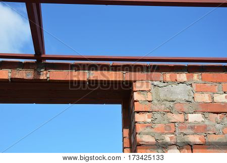 Close up on lintel. Window metal lintel on brick unfinished house construction.