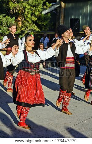 Ivanovo Serbia August 15 2016. The group of young people dancing traditional folk dances from the region of Serbia.