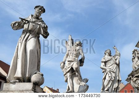 MARIBOR, SLOVENIA - APRIL 03: Saints Francis of Assisi, Sebastian and James statue, Plague column at Main Square of the city Maribor in Slovenia. Historical religious sculpture, April 03, 2016.