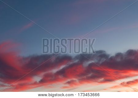 Beautiful red sunset clouds sky at dusk