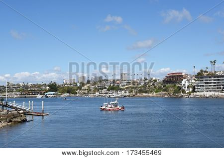 NEWPORT BEACH, CALIFORNIA - FEBRUARY 22, 2017: Newport-Avalon Channel seen from the Balboa Peninsula looking towards the Corona Del Mar Bend.