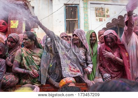 Barsana, India - March 17, 2016: Indians widows celebrate Lathmar Holi in Barsana village, Uttar Pradesh, India.