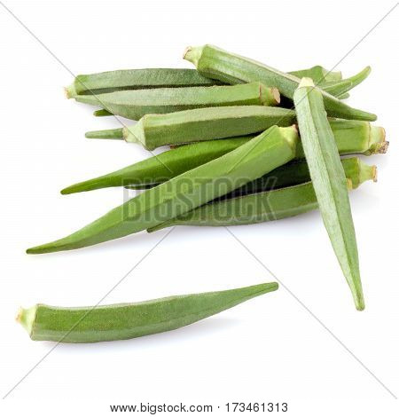 Heap of okra pods isolated on white background.