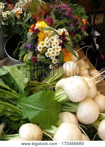 Lovely Display of Flowers and Vegetables at a Market