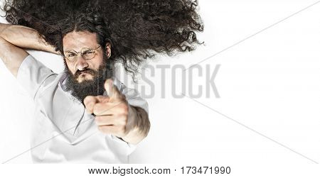 A nerdy scientist or doctor pointing at your face