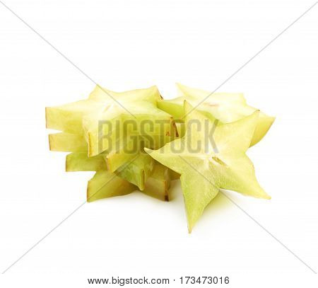 Pile of sliced carambola starfruit fruits isolated over the white background