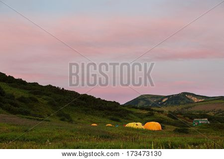 Campground in the brookvalley Spokoyny at the foot of outer north-eastern slope of caldera volcano Gorely.