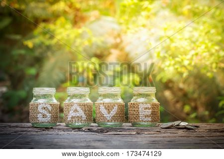 Empty bottle on the wooden background for business concept