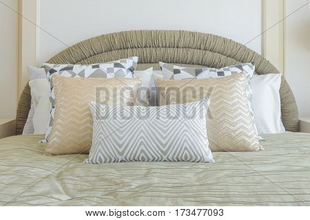 Graphic Pattern Silver And Golden Pillows Setting On Bed With Light Gold Color Blanket In Classic St