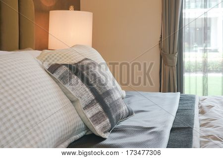 Ckecked Pattern Pillows On Bed In Luxury Style Interior Bedroom
