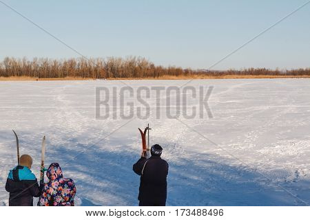 Group Of People Skiing.
