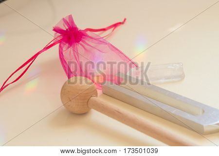 tuning fork and crystal on table .