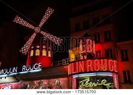 PARIS FRANCE - February 28, 2015: Cabaret Moulin Rouge by night. French landmarks and travel destinations concept.
