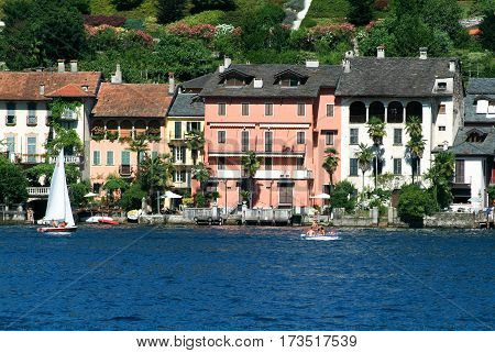 People Sailing On A Sailboat Front Of Orta